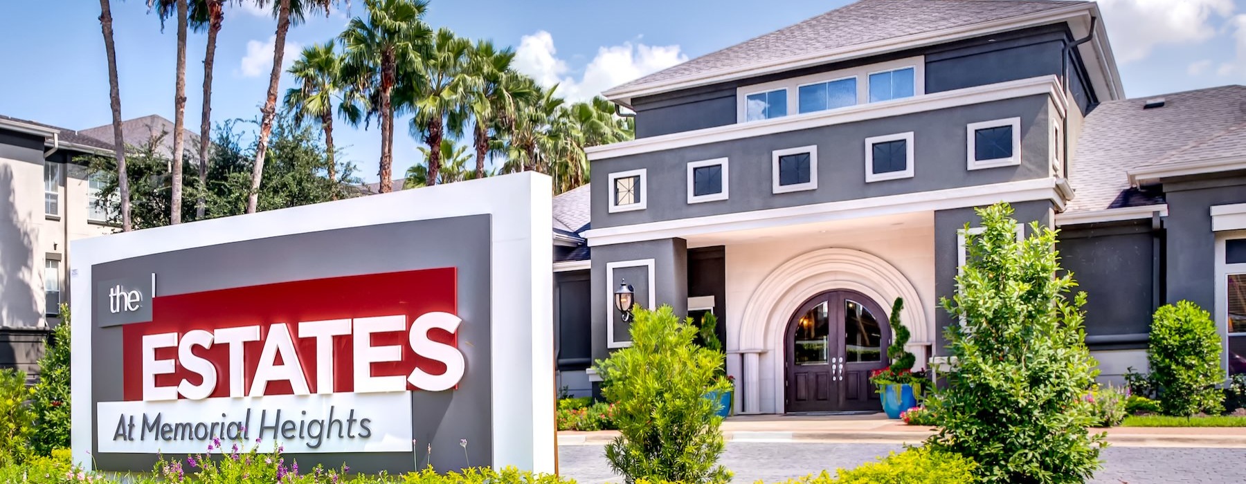 a sign in front of a building