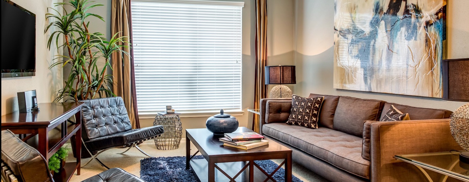 a living room with a couch and chairs